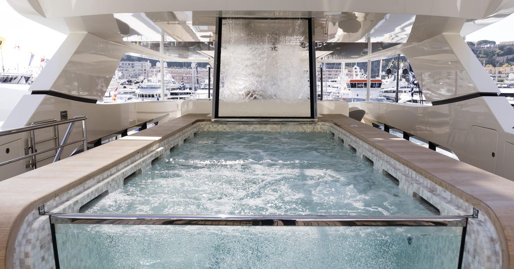 Infinity pool with waterfall onboard charter yacht ANDIAMO