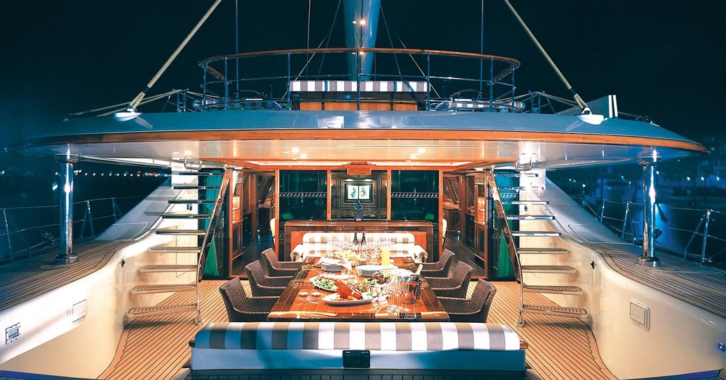 cockpit set up for dinner at night time aboard charter yacht TIARA 