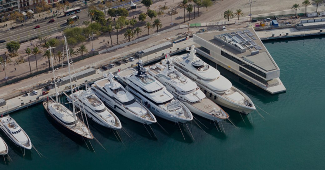 Superyachts lined up in OneOcean Port Vell, Barcelona