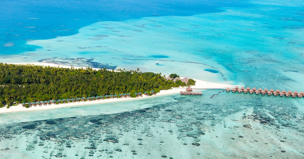 The Maldives aerial picture of beaches, blue sea and lush greenery