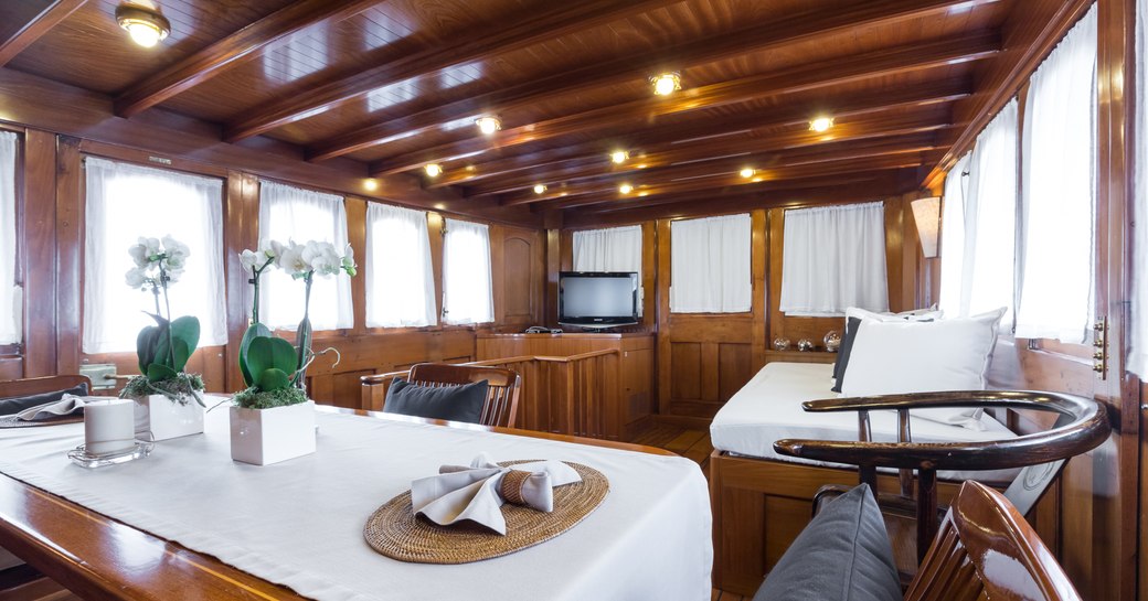 superyacht over the rainbow over the rainbow entertainment area with table and tv 