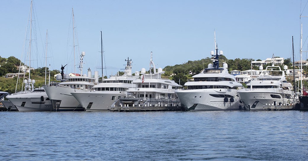 Line of charter yachts berthed at the Antigua Charter Yacht Show