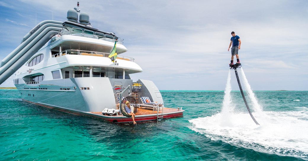 A charter guest playing with toys on board M/Y Zoom Zoom Zoom