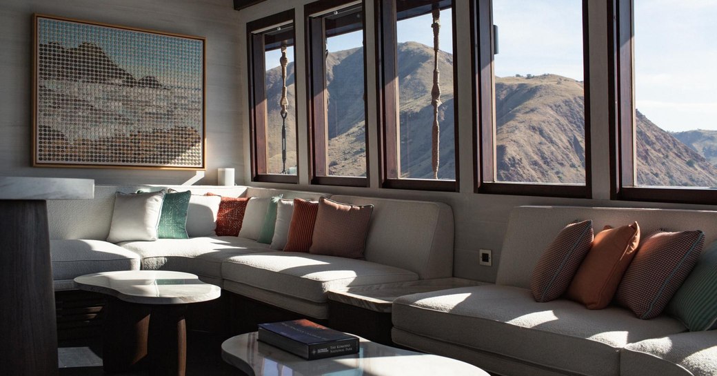 Overview of the seating area in the main salon onboard charter yacht VELA