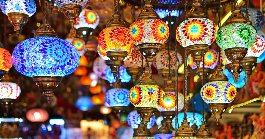 Painted lights hanging from ceiling in bazaar in turkey