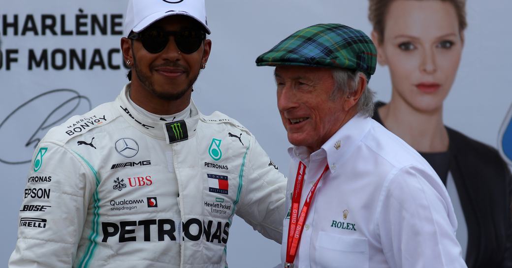 Lewis Hamilton of Mercedes AMG Petronas Motorsport celebrates in parc ferme with Jackie Stewart after qualifying for the F1 Grand Prix of Monaco