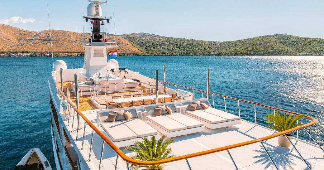 Charter yacht VICTORY sundeck with sunpads and alfresco seating