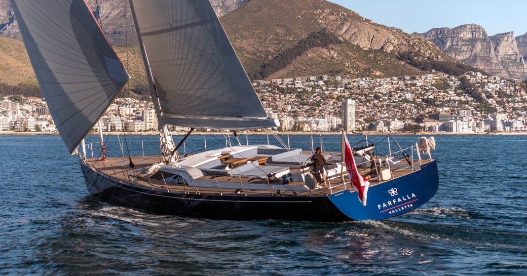 Sailing yacht FARFALLA on the water with man on stern