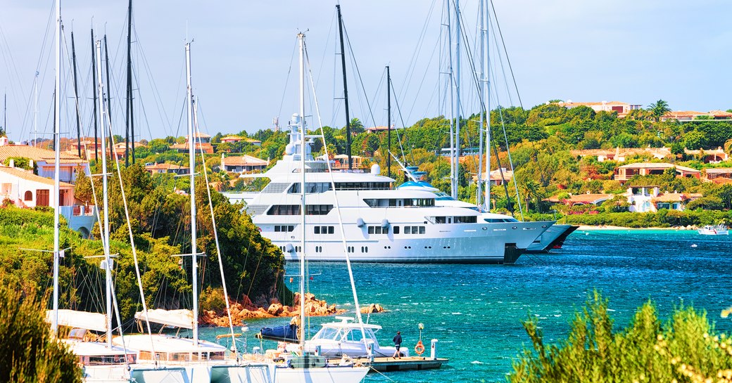 Superyacht charter at anchor in a bay in the Mediterranean