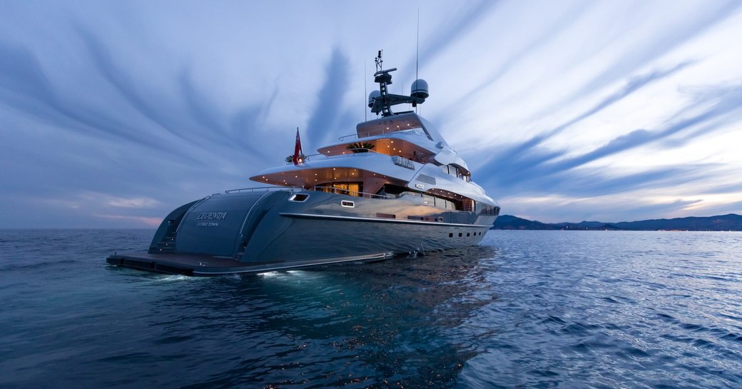 Superyacht LEGENDA cruising at dusk