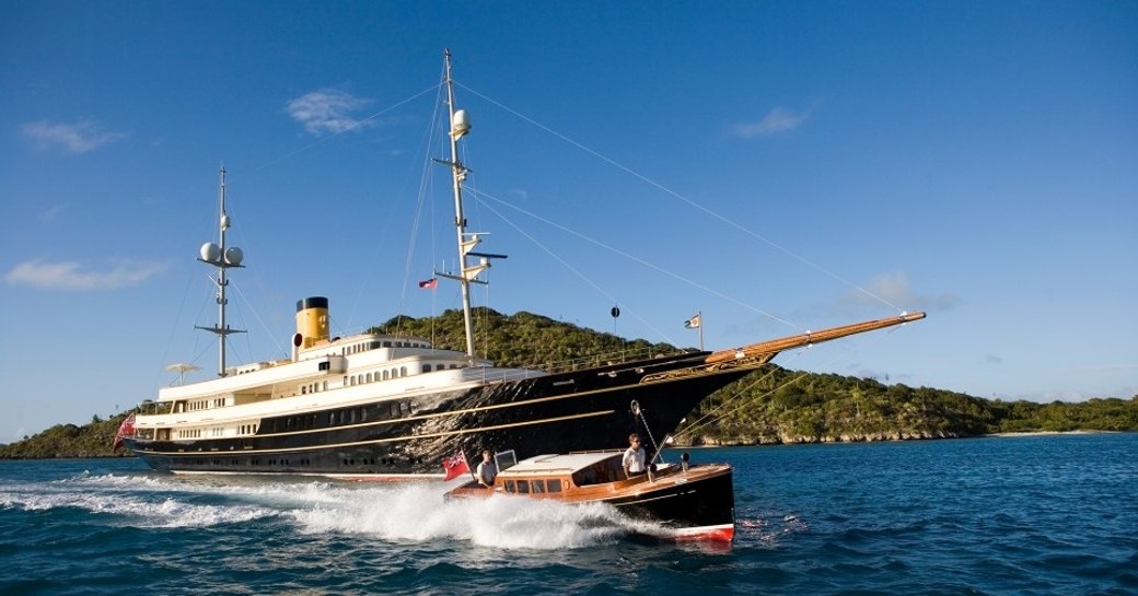 classic yacht NERO underway alongside tender on a luxury yacht charter