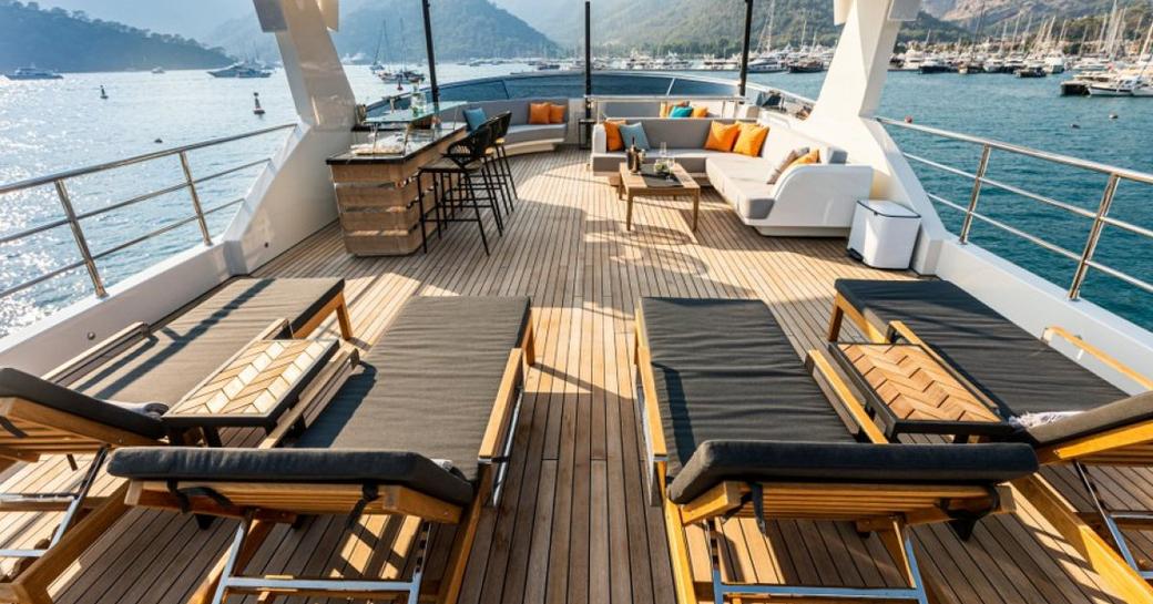 Sun deck with sun loungers onboard charter yacht ZEEMAR