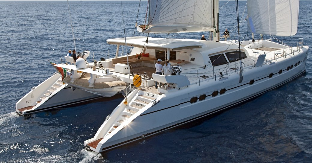 Profile of catamaran Orion while on charter with bow shown