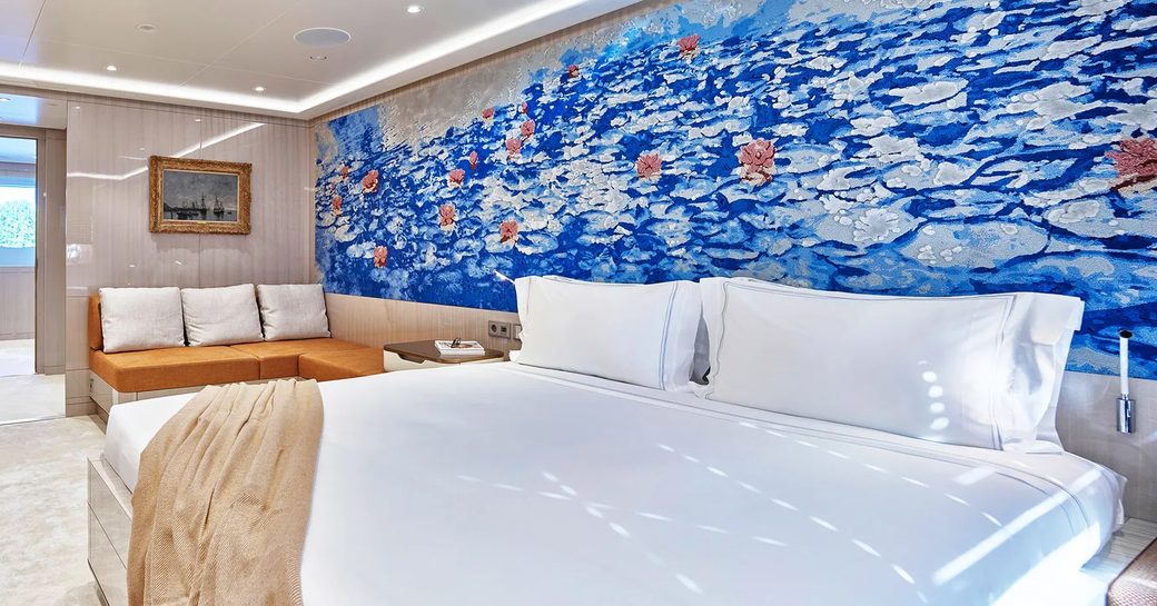 master cabin on luxury yacht soaring, with blue painted headboard