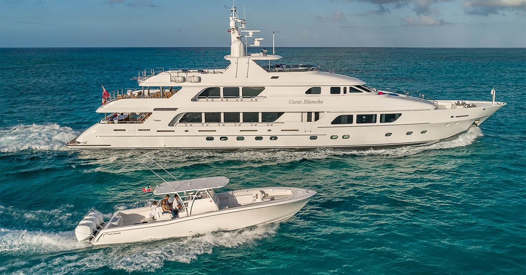 Charter yacht CARTE BLANCHE and tender at sea