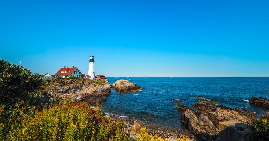 Rocky coastline and a lighthouse in North America
