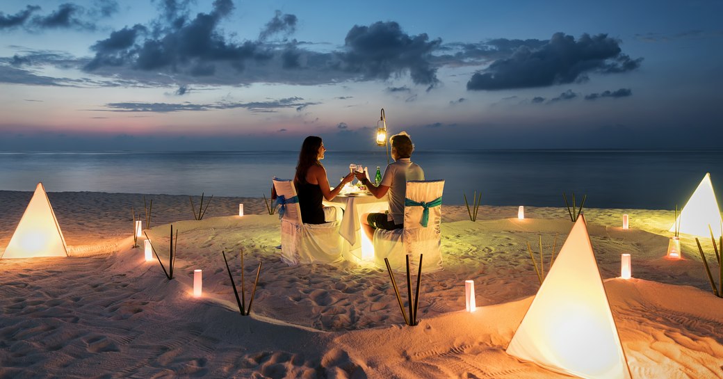 couple dining on the beach in the Maldives