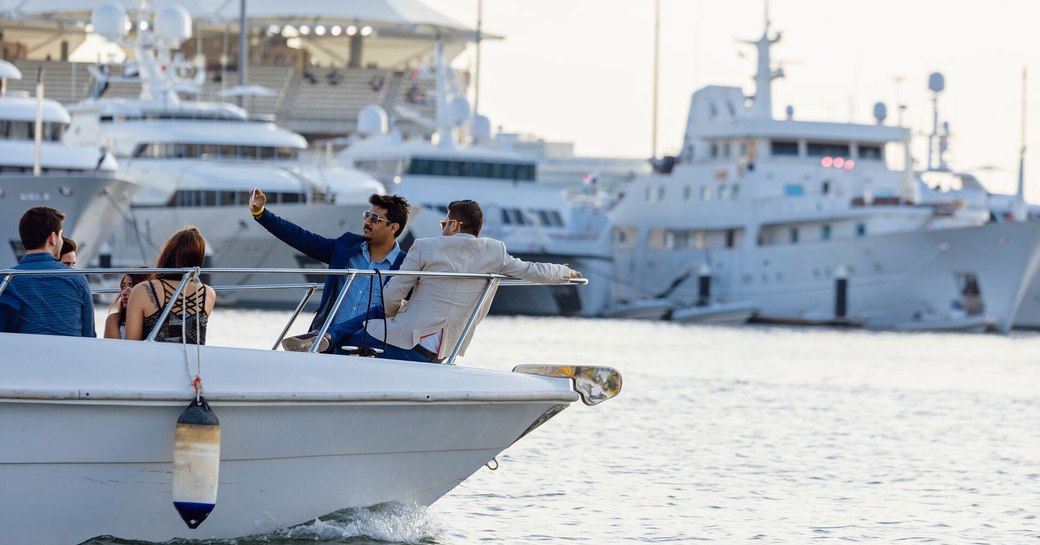 two men taking a selfie onboard a luxury yacht in Yas Marina, Abu Dhabi