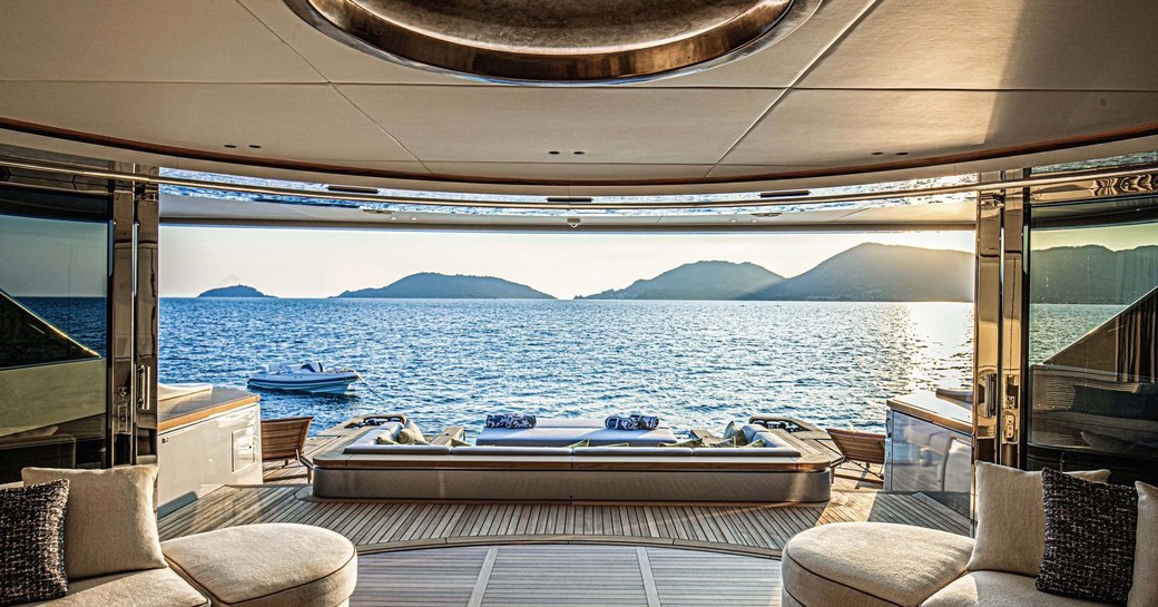 main salon and wide open glass doors on board benetti superyacht rebeca