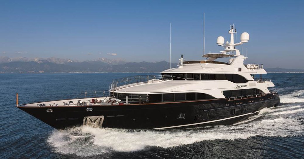 Profile shot of superyacht CHECKMATE on the water