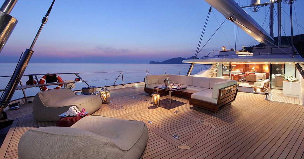 aft deck on charter yacht prana, with seating area in foreground and main salon in background