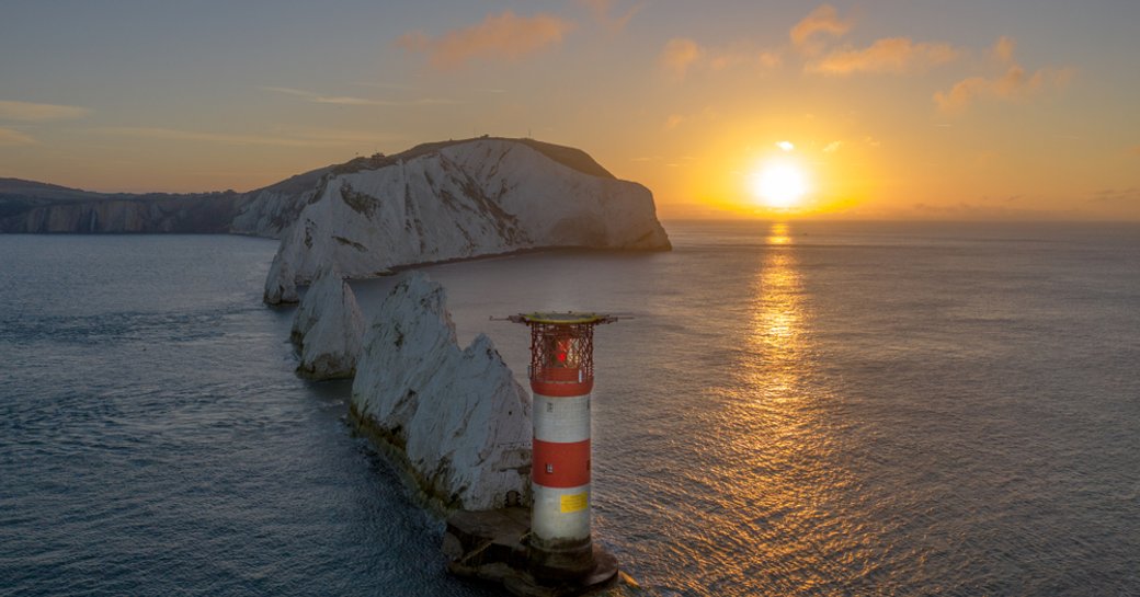 the needles rock formation in isle of wight at sunset