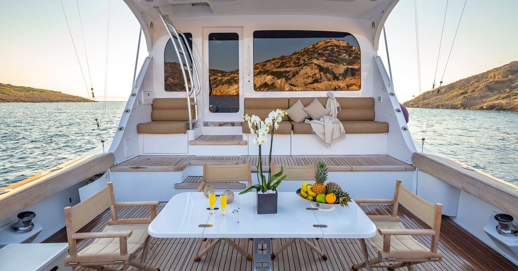 The alfresco dining section on the aft deck of superyacht ASTRAPE