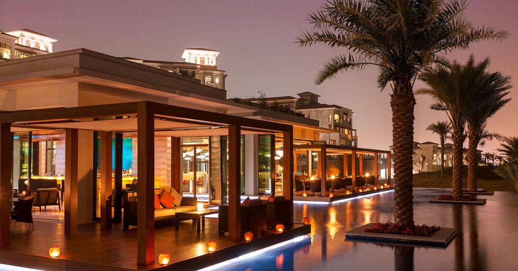 Sontaya restaurant surrounded by water features and palm trees in St Regis Saadiyat Island Resort, Abu Dhabi