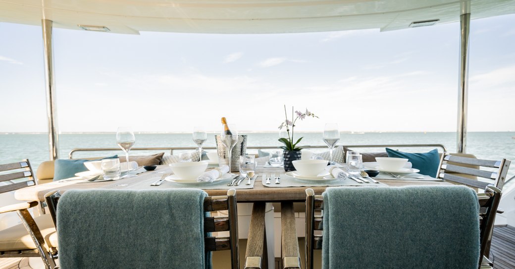 Alfresco dining on the aft deck onboard charter yacht CHESS