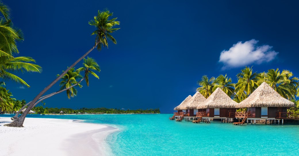 Blue water by a sandy beach in French Polynesia