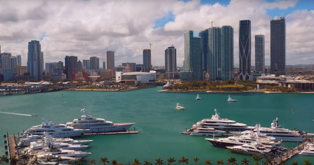 panoramic shot of superyachts lined up at superyacht miami