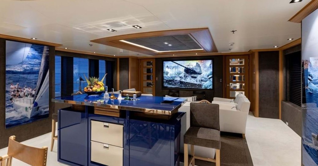 Skylounge of superyacht Deja Too, with naby blue island and large screen TV