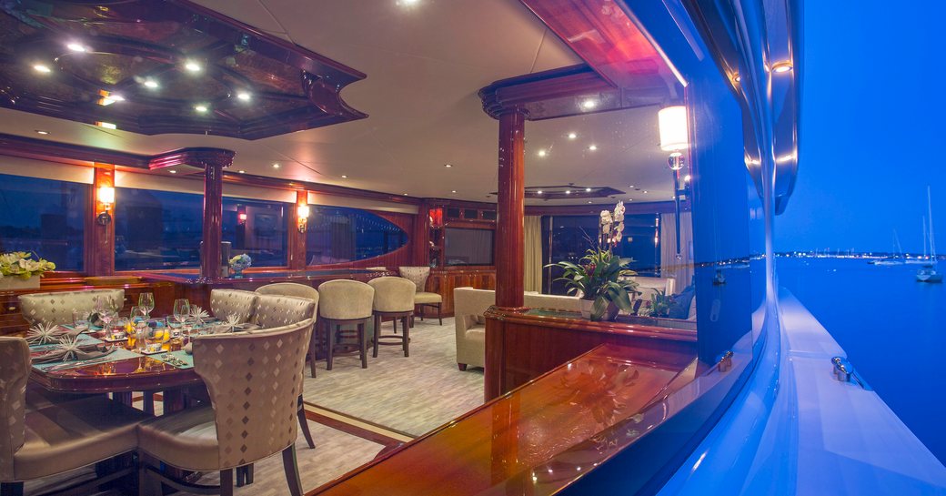 view of main salon of superyacht ‘Gale Winds’ from her wraparound deck