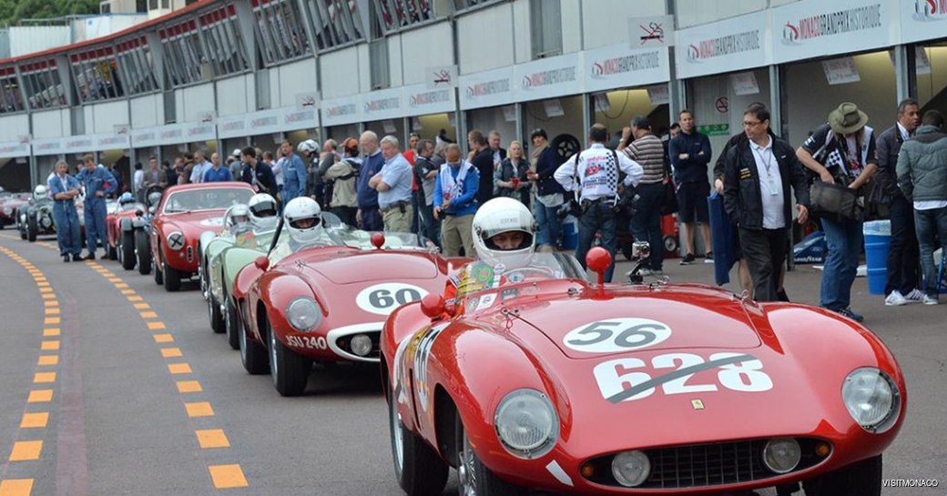 Lineup of historic Grand Prix cars at Monaco Historic Grand Prix along pit lane.