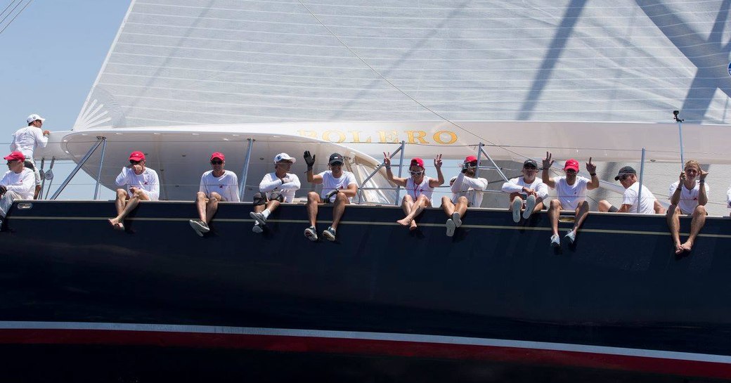 crew with legs over the side of charter yacht BOLERO during the Superyacht Cup Palma 2018 