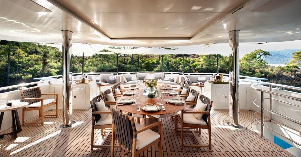 alfresco dining on aft deck of superyacht Orient Star