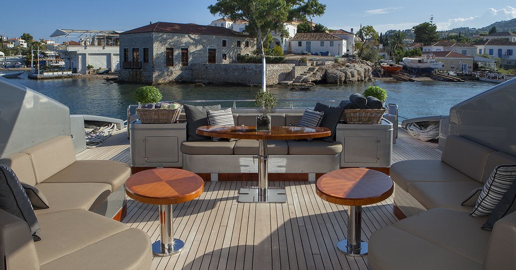 lounging and sunning on cockpit aft of motor yacht  'My Toy'