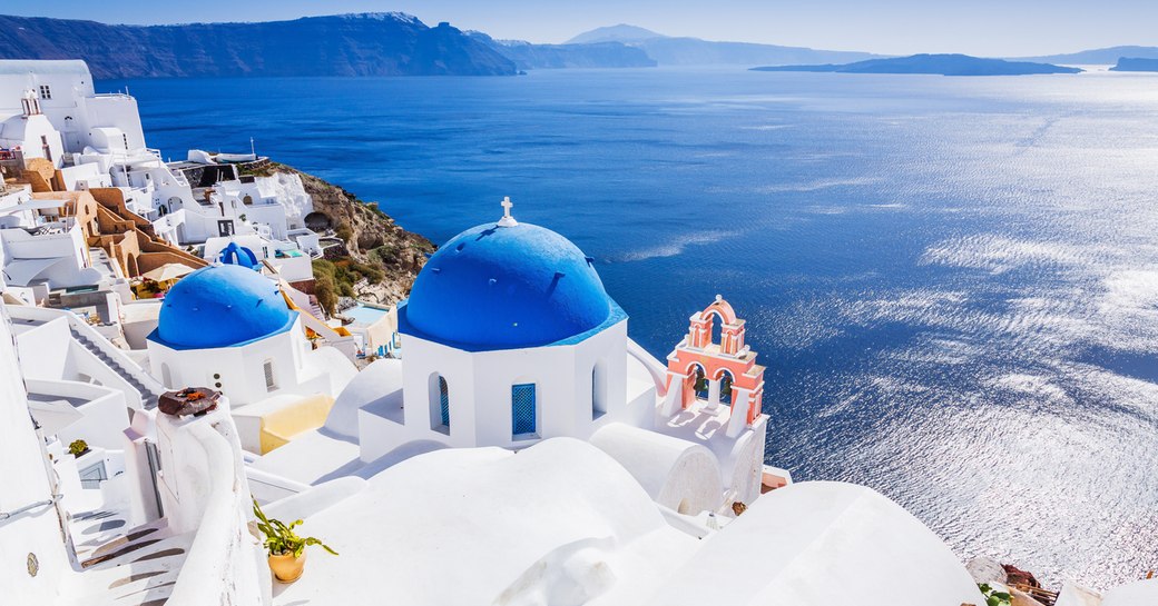 blue and white buildings in town of santorini in greece 