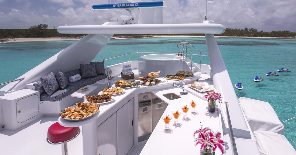 bar and spa pool on sundeck of motor yacht at last