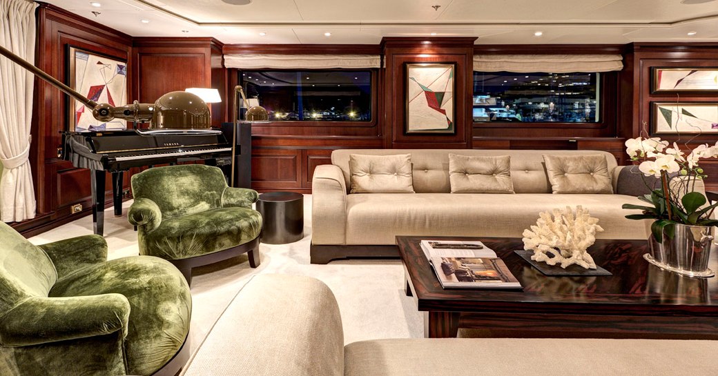 sophisticated main salon aboard superyacht ‘Azteca II’  with lounge and piano