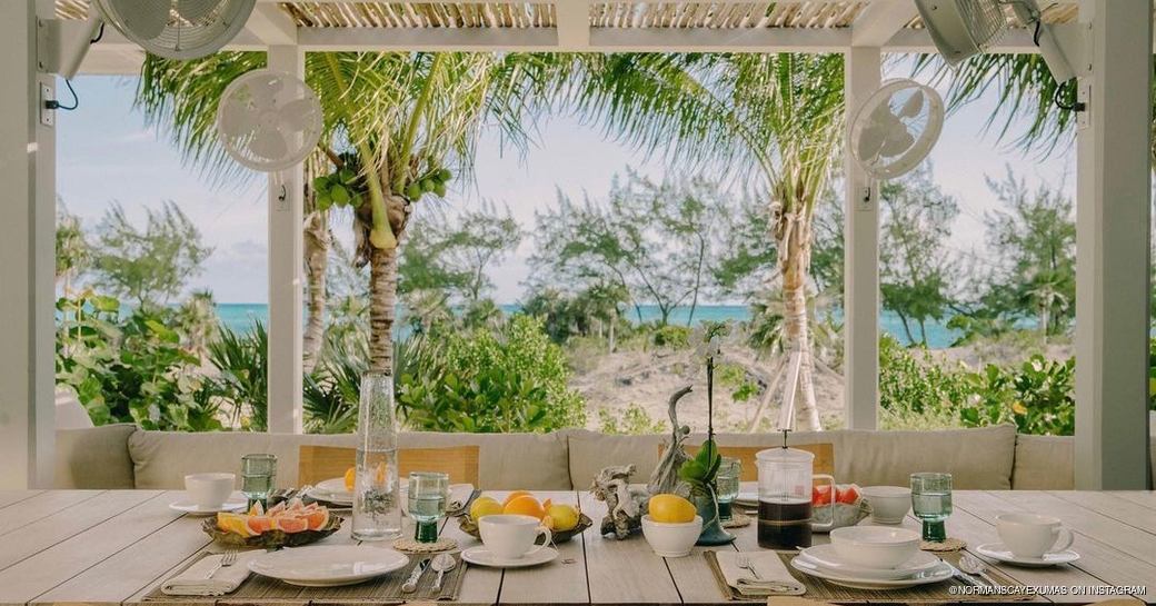 Al fresco dining area set on the beach set for a meal 