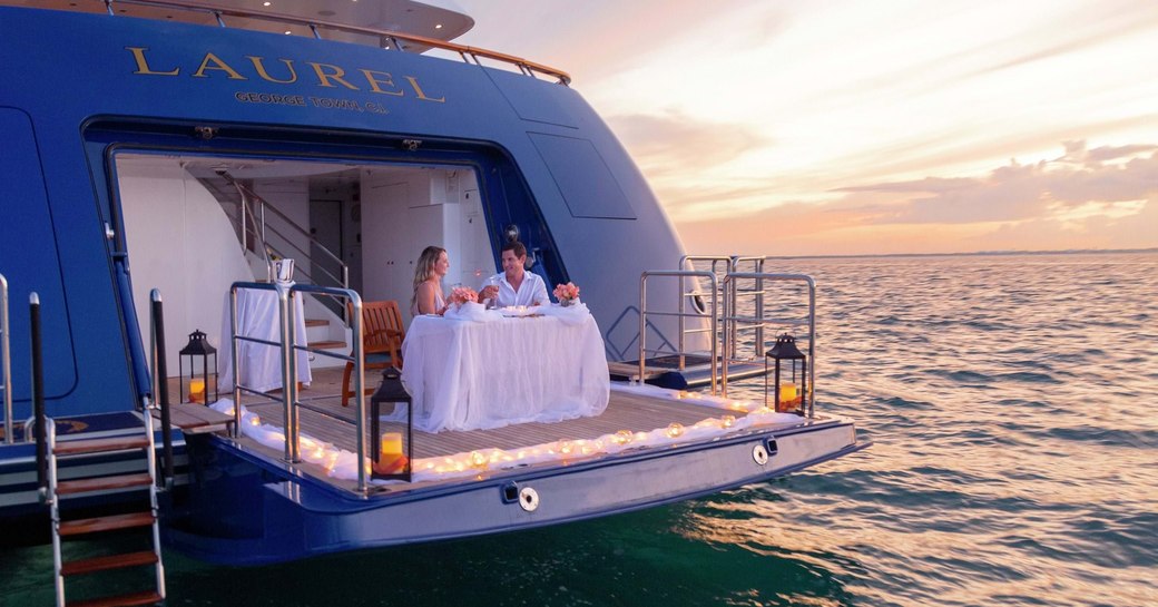 romantic meal on swim platform of superyacht