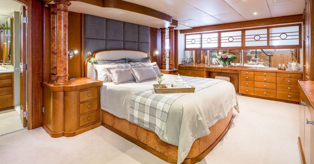 master cabin on luxury yacht daydream, with island bed and plenty of space surrounding