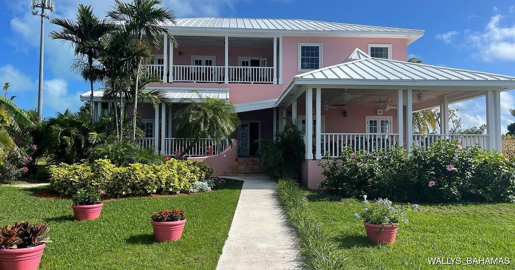 Garden path to Wally's Restaurant entrance in their iconic pink building