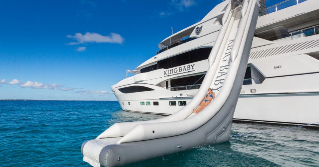 charter guest tries out the water slide on board motor yacht ‘King Baby’ 