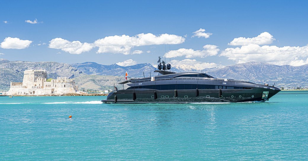 Portion of harbour in Nafplion, Greece, with beautiful superyacht in foreground.