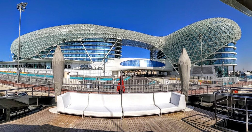 the trackside view of a lucury cuperyacht berthed by the race track at abu dhabi grand prix 2019