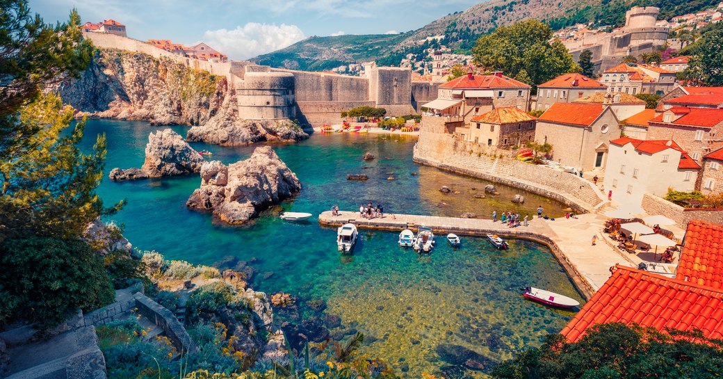 Сharm of the ancient cities of Europe. Aerial mornig view of Old Town from Fort Bokar. Picturesque summer cityscape of Dubrovnik. Sunny seascape of Adriatic sea, Croatia, Europe