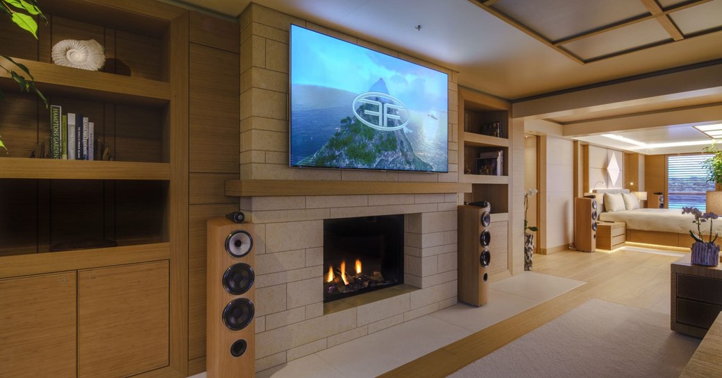 Owner's apartment living area, with fireplace and large TV screen