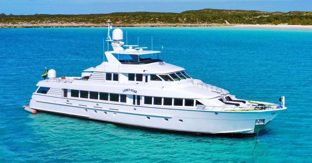 Charter yacht LONE STAR at anchor, surrounded by sea